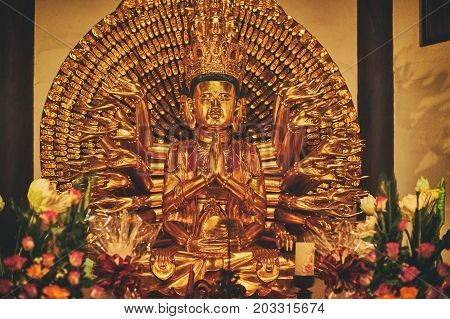 Vietnamese buddhist temple in Ukraine. Golden Avalokiteshvata statue