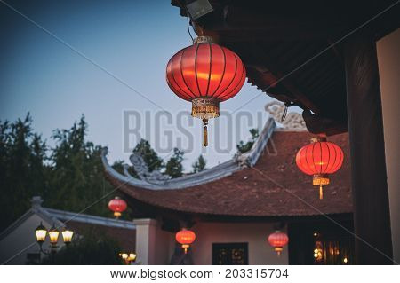 Vietnamese buddhist temple. Red lanterns and pagoda