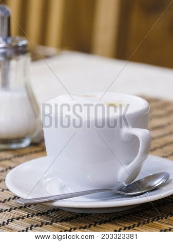 Cup of a coffee on a table