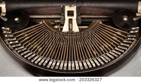the mechanical typebars of an obsolete typewriter