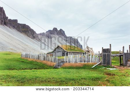 Traditional Viking village. Wooden houses near the mountain first settlements in Iceland