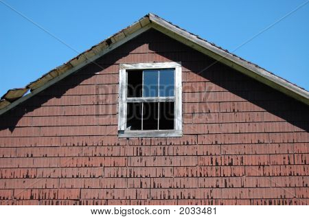 Broken Window On Old Barn