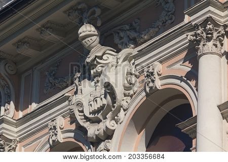 Fretwork in the form of a knight on the wall of the house. Architecture