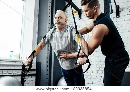 Senior Sportsman Training With Trx