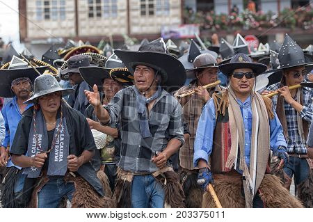 June 29 2017 Cotacachi Ecuador: kichwa indigenous people dancing on the street during Inti Raymi festival