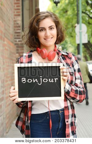 Woman Holding Chalkboard With Text 