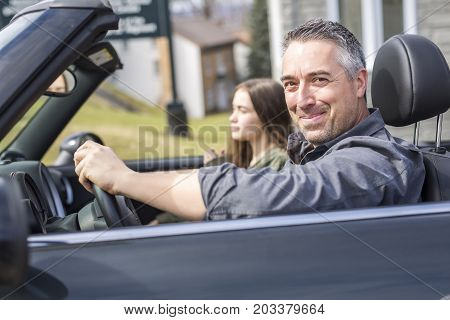 A Father On Car Journey With Teenage daughter