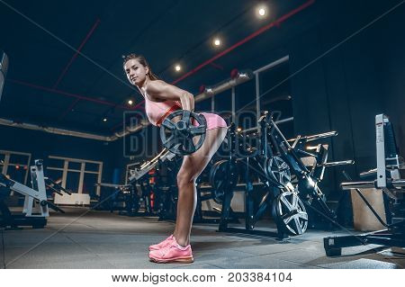 Sexy Athletic Young Girl Training Back In Gym