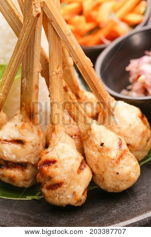Minced meat skewers served on the table