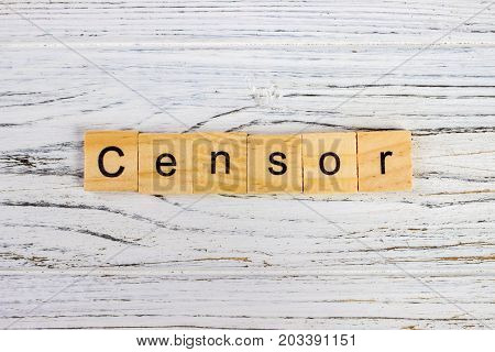 CENSOR word made with wooden blocks on the table