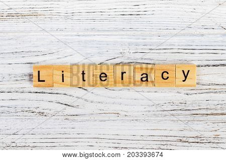 LITERACY word made with wooden blocks concept