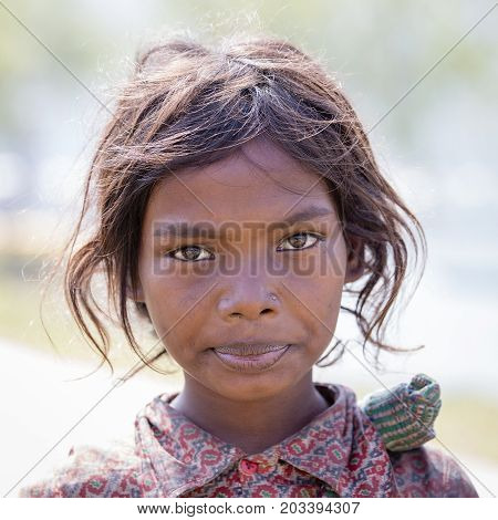 HIMALAYAS ANNAPURNA REGION NEPAL - OCTOBER 23 2016 : Portrait nepalese child on the street in Himalayan village Nepal