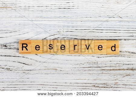 RESERVED word made with wooden blocks concept