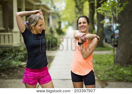 Two Beautiful Female runner outside having fun