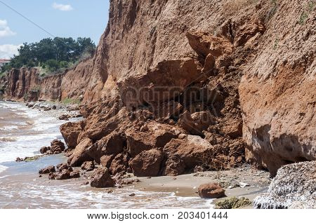 Effects of seaside coastal erosion with clayey soil