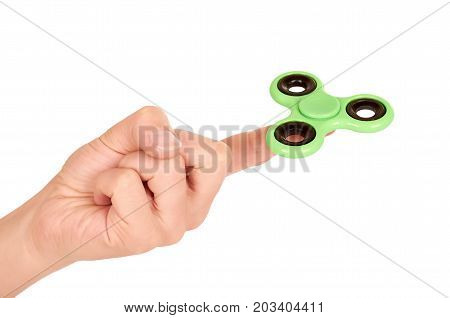 Green Fidget Spinner In Hand Isolated On White Background