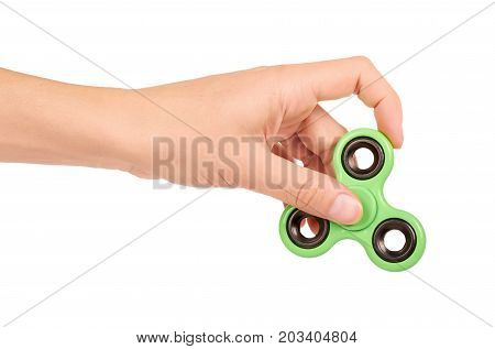 Green Fidget Spinner In Hand Isolated On White Background