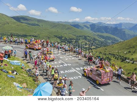 Col de PeyresourdeFrance- July 23 2014: Cochonou vehicle passing in the Publicity Caravn on the road to Col de Peyresourde in Pyrenees Mountains during the stage 17 of Le Tour de France 2014.