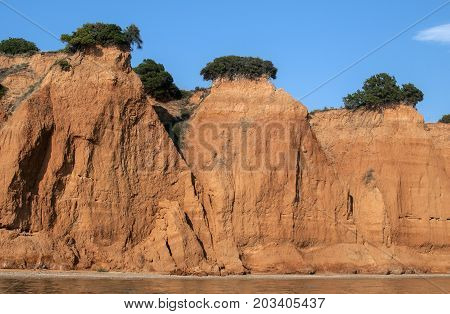 Effects of seaside coastal erosion with clayey soil