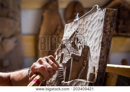 Sculptor Hands Working Wood