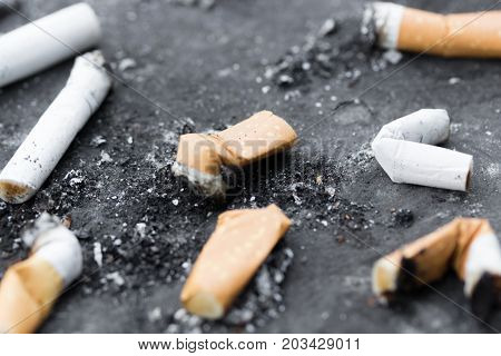 Cigarette butts, ant i- smoking law .