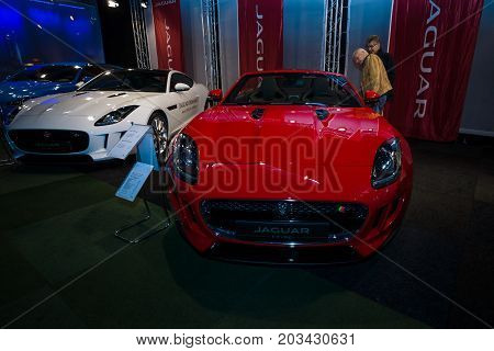 MAASTRICHT NETHERLANDS - JANUARY 08 2015: Sports cars Jaguar F-Type Roadster (foreground) Coupe and XF Sportbrake (background). International Exhibition InterClassics & Topmobiel 2015