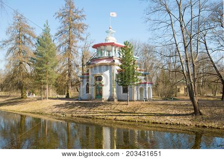 View of the old Creaking (Chinese) arbor in the sunny May afternoon. Tsarskoye Selo, Russia