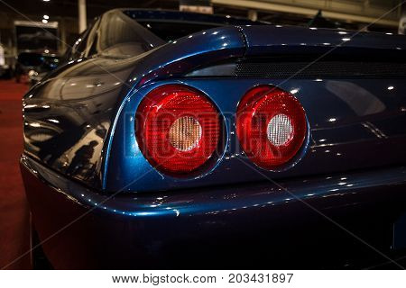 MAASTRICHT NETHERLANDS - JANUARY 08 2015: Stop lights of a sports car Ferrari F355 Berlinetta. International Exhibition InterClassics & Topmobiel 2015