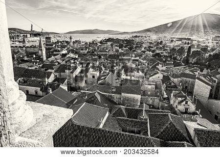 Historic town Trogir from Cathedral of St. Lawrence Unesco Croatia sunset scene. Travel destination. Architectural scene. Summer vacation. Black and white photo.
