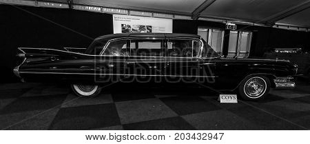MAASTRICHT NETHERLANDS - JANUARY 08 2015: Full-size luxury car Cadillac Series 75 Fleetwood 6700 Limousine 1959. Black and white. International Exhibition InterClassics & Topmobiel 2015
