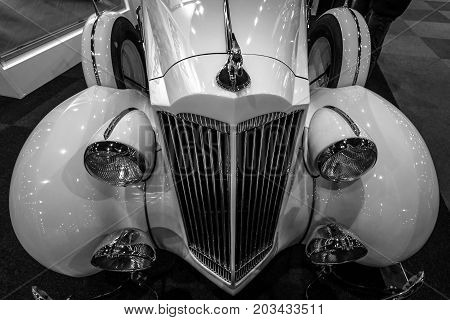 MAASTRICHT NETHERLANDS - JANUARY 08 2015: Fragment of a Packard 120 Convertible Sedan with Dietrich Body 1937. Black and white. International Exhibition InterClassics & Topmobiel 2015