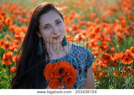 Portrait Of Woman With Bunch Of Poppies