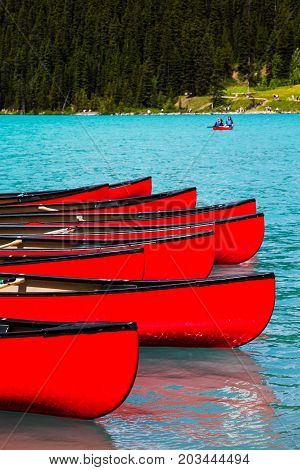 Row of red canoes at Lake Louise Banff National Park Canada