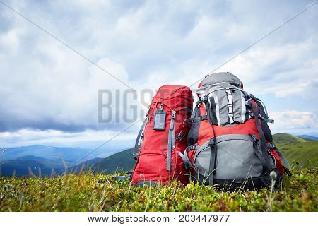 Backpacks in the mountains with views of the mountains.