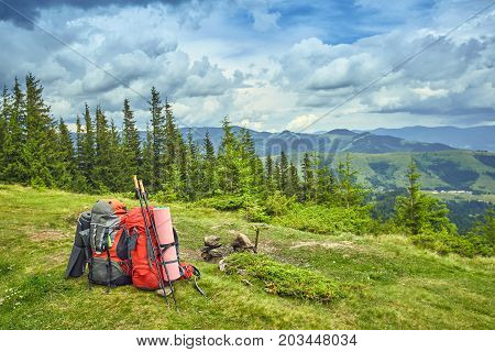 Backpacks in the mountains with views of the mountains.