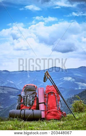 Backpacks in the mountains with views of the mountains.
