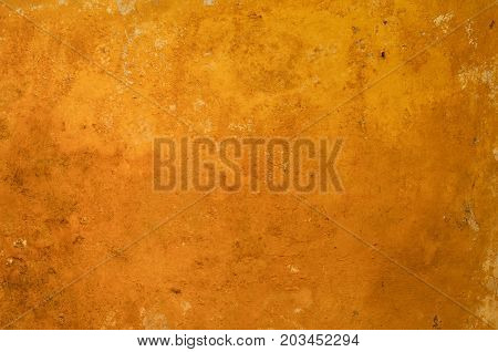 orange and copper-colored background in the form of old and rusted metal
