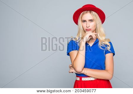 Portrait Of A Stunning Fashionable Lady In Bright Red Dress Posing Over Gray Background. Colors Of S