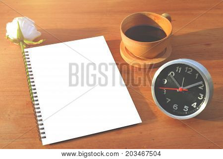 Concept Insights message on notebook with pencil and coffee cup on wooden table.