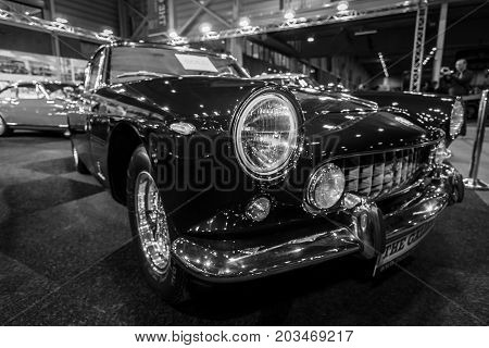 MAASTRICHT NETHERLANDS - JANUARY 09 2015: Sports car Ferrari 250GT/E 1962. Black and white. International Exhibition InterClassics & Topmobiel 2015