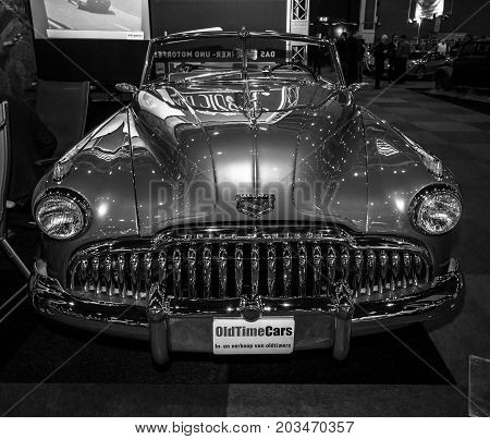 MAASTRICHT NETHERLANDS - JANUARY 09 2015: Full-size car Buick Super convertible (Third generation) 1949. Black and white. International Exhibition InterClassics & Topmobiel 2015
