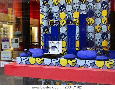 LE MANS - FRANCE JULY 27 2017: Storefront with sunglasses from different brands. Optic store