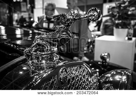 MAASTRICHT NETHERLANDS - JANUARY 08 2015: Hood ornament Goddess of Speed (donuts chaser) of a Packard Series 733 Coupe 1930. Black and white. International Exhibition InterClassics & Topmobiel 2015