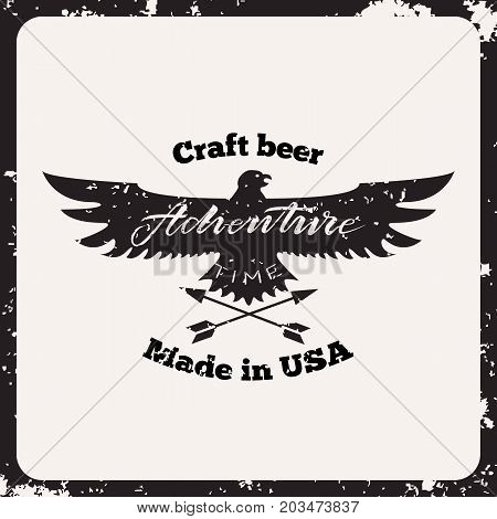 Vintage label with textured eagle, arrows and lettering - adwenture time. Craft beer retro label. Isolated on shabby background.
