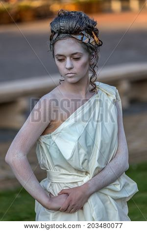 TIMISOARA ROMANIA - SEPTEMBER 8 2017: Living statue of a woman dressed with antical elements and present on the street inside the CheckART Carnival organized by the City Hall Timisoara. Union Square