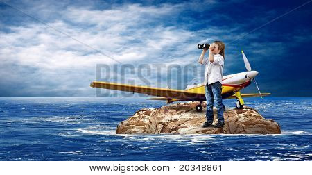 Barn med flygplan på ön i havet.
