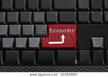 Keypad of black keyboard and have text Economy on enter button for design background in your work.