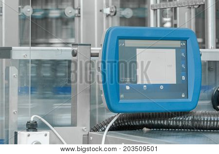 close-up of the control panel in the shop for bottling in plastic bottles. touch panel control