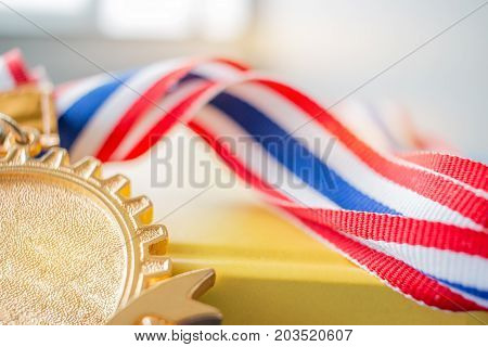 Golden medals on book graduate education in university Competitions and Education study concepts. Success in study famous institution Concept of winner abroad international.