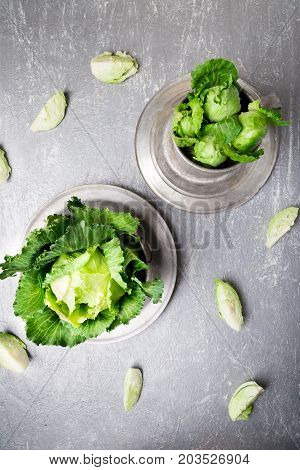 Fresh Green Cabbage In Metal Plate On Grey Background. Top View. Copy Space.